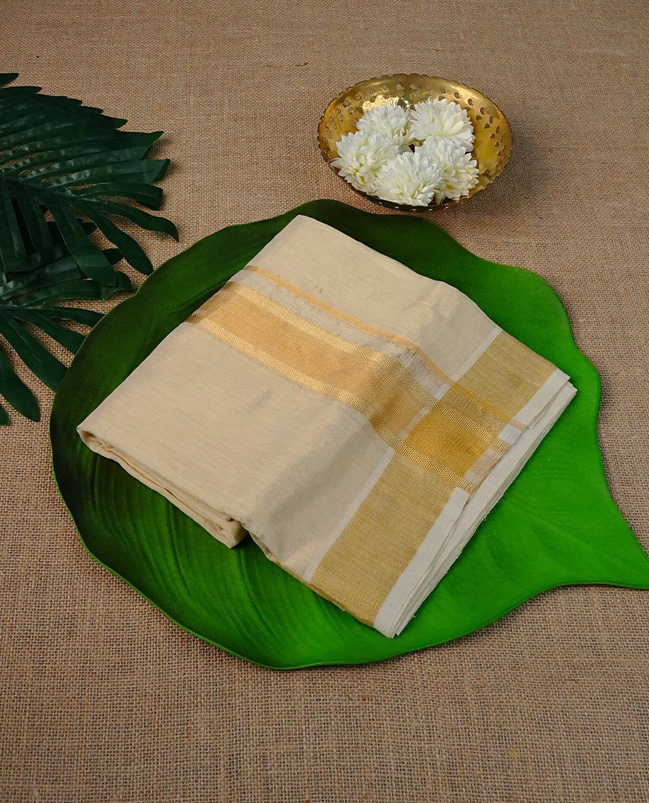 Cream colour pure tissue Double dhoti featuring plain with Gold zari kara.