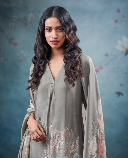 Gray colour suit material with pakiza silk printed top featuring subtle embroidery on the body, paired with matching bottom and lightweight printed dupatta. (Copy)