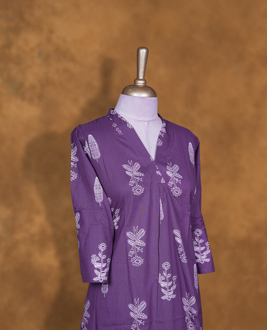 Purple colour coord set featuring cream colour floral pattern across body with v neckline and matching pant.