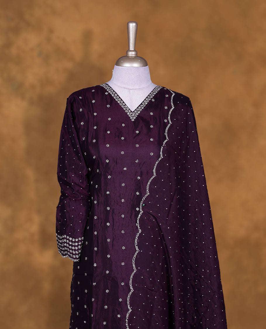 Dark purple colour sharara set featuring gold stone pattern neckline, sleeves, and stone pattern across on body , Paired with a matching dupatta