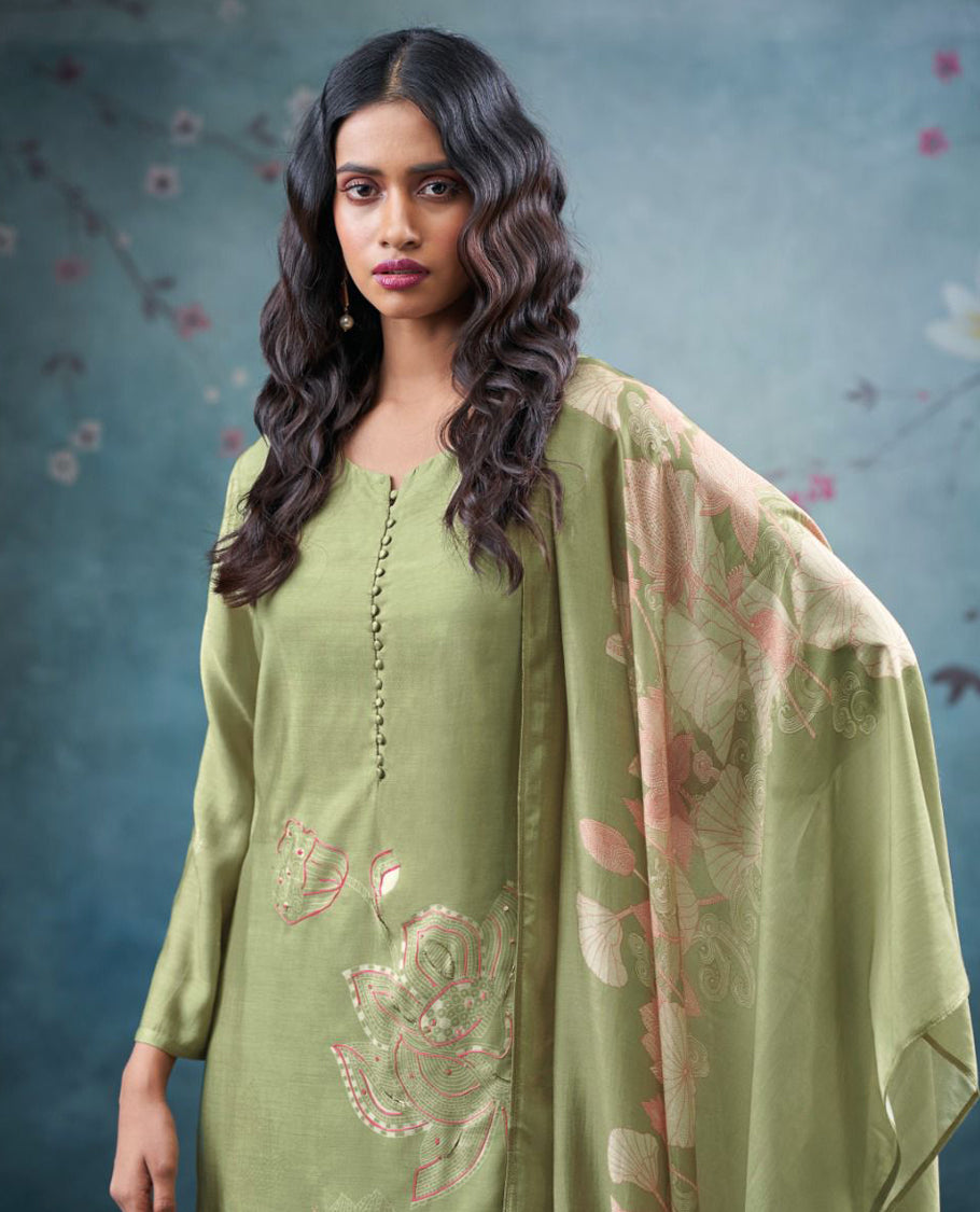 Pista Green colour suit material with pakiza silk printed top featuring subtle embroidery on the body, paired with matching bottom and lightweight printed dupatta.