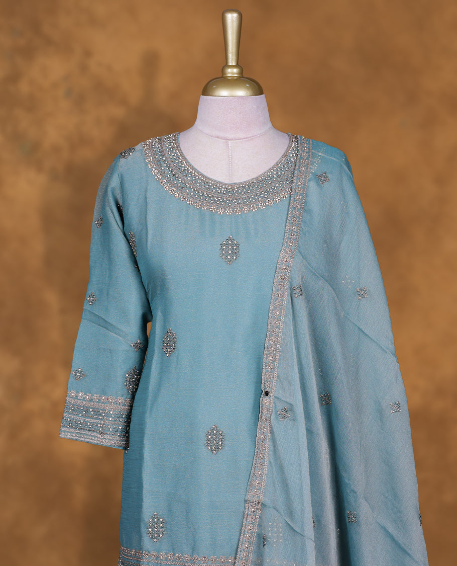 Dusty blue colour sharara set featuring gold colour stone worked on neckline, sleeves, and stone scattered pattern on body , Paired with a matching dupatta