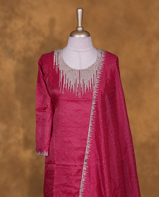 Rani pink colour sharara set featuring gold stone pattern neckline, sleeves, and stone pattern across on body , Paired with a matching dupatta