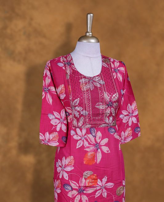 Rani pink colour kurti with styled with a thread pattern around neckline & Floral print across body, knee length design, and a sleeve .