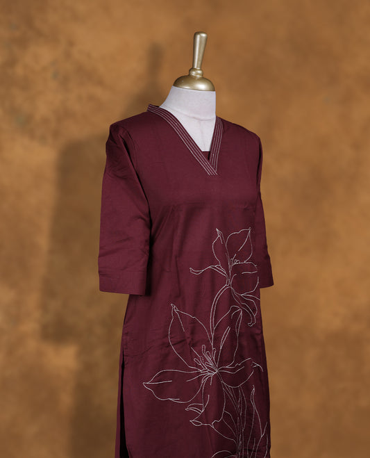 Maroon colour coord set by Vismay with styled with a V with thread embroidery on neckline & sleeve,floral thread pattern on body, knee length design, with matching bottom .