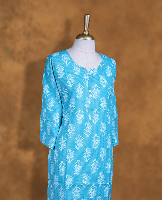 Sky colour kurti with White floral prints, knee length design, styled with a round with slit neckline and a sleeve .