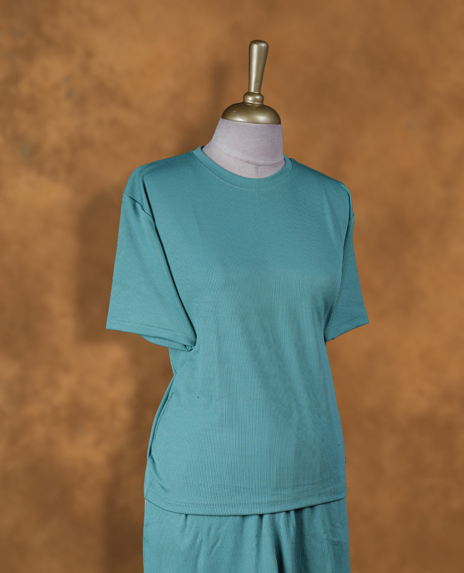 Aqua blue colour coord set with styled with a round neckline & sleeve, with matching bottom .