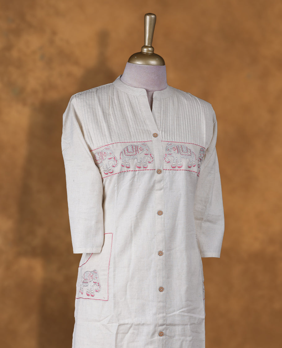 Cream colour coord set featuring elegant pink & silver thread embroidery work, mandarin collar, bottn details and sheer 3/4 sleeves, Paired with matching pants,