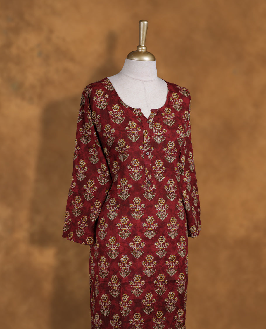 Brown colour Kurti featuring floral print pattern across,  round neckline with split, and sleeves.
