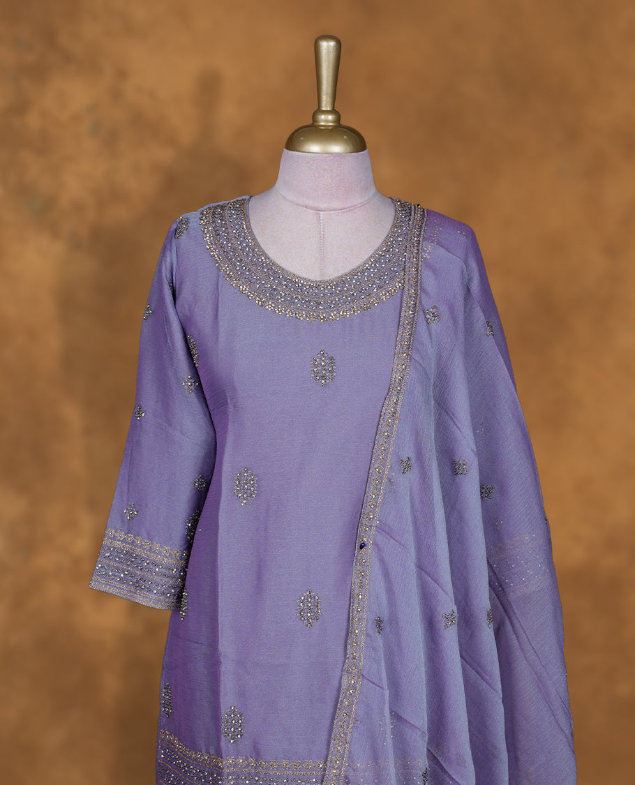 Lavender colour sharara set featuring gold colour stone worked on neckline, sleeves, and stone scattered pattern on body , Paired with a matching dupatta