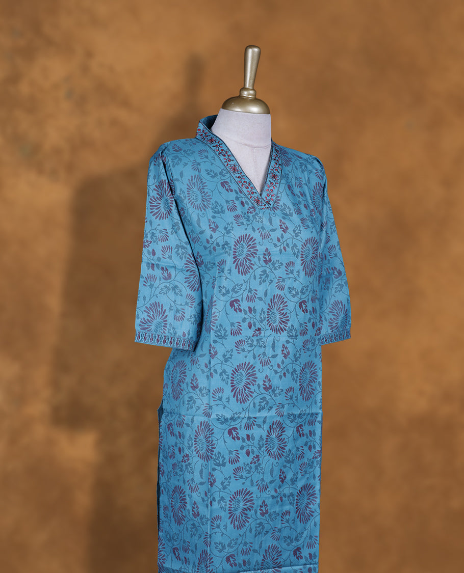 Blue colour kurti with styled with a thread pattern around neckline, print on body knee length design, and a sleeve .