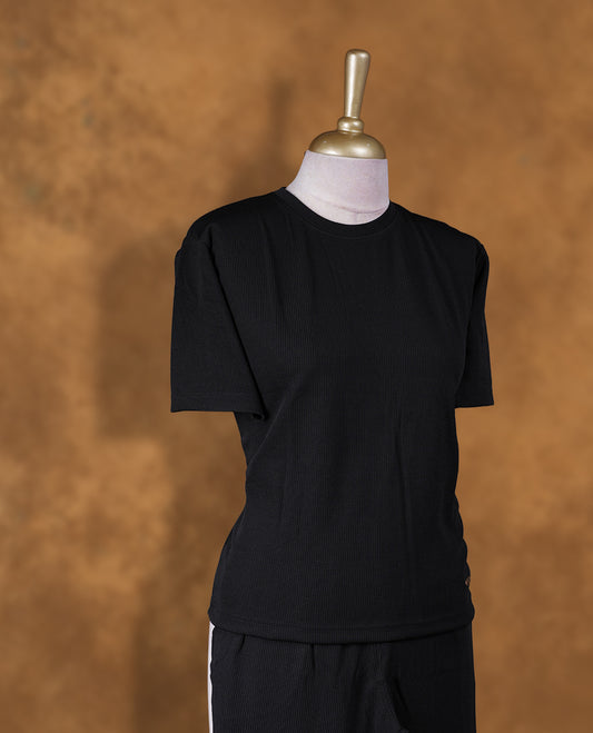 Black colour coord set styled with a T shirt design with short sleeve, pair a matching bottom pant .