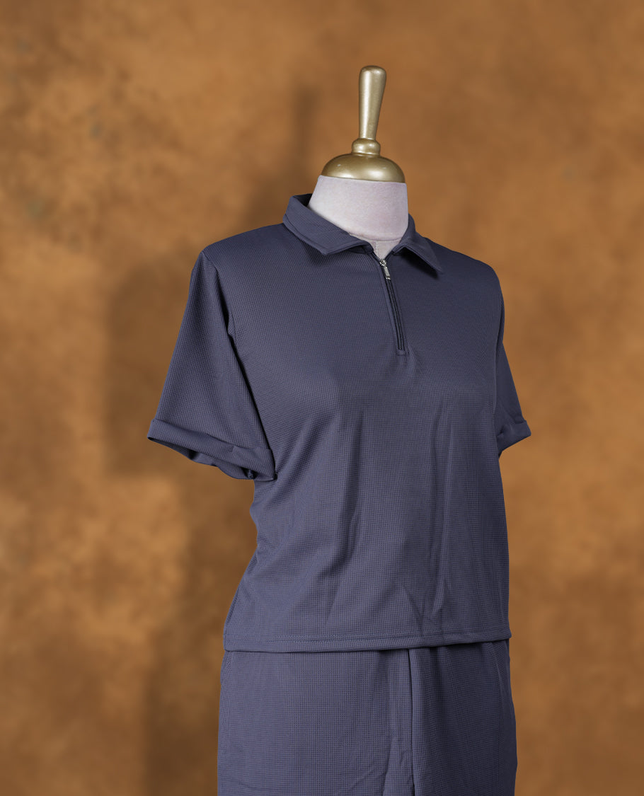 Gray colour coord set styled with a T shirt design with zip detailed & collar , short sleeve, pair a matching bottom pant .