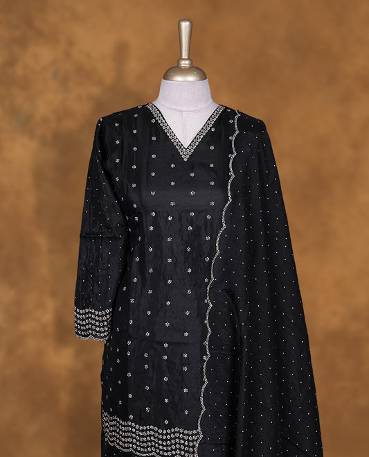 Black colour sharara set featuring gold colour stone worked on neckline, sleeves, and Stone scattered on body , Paired with a matching dupatta