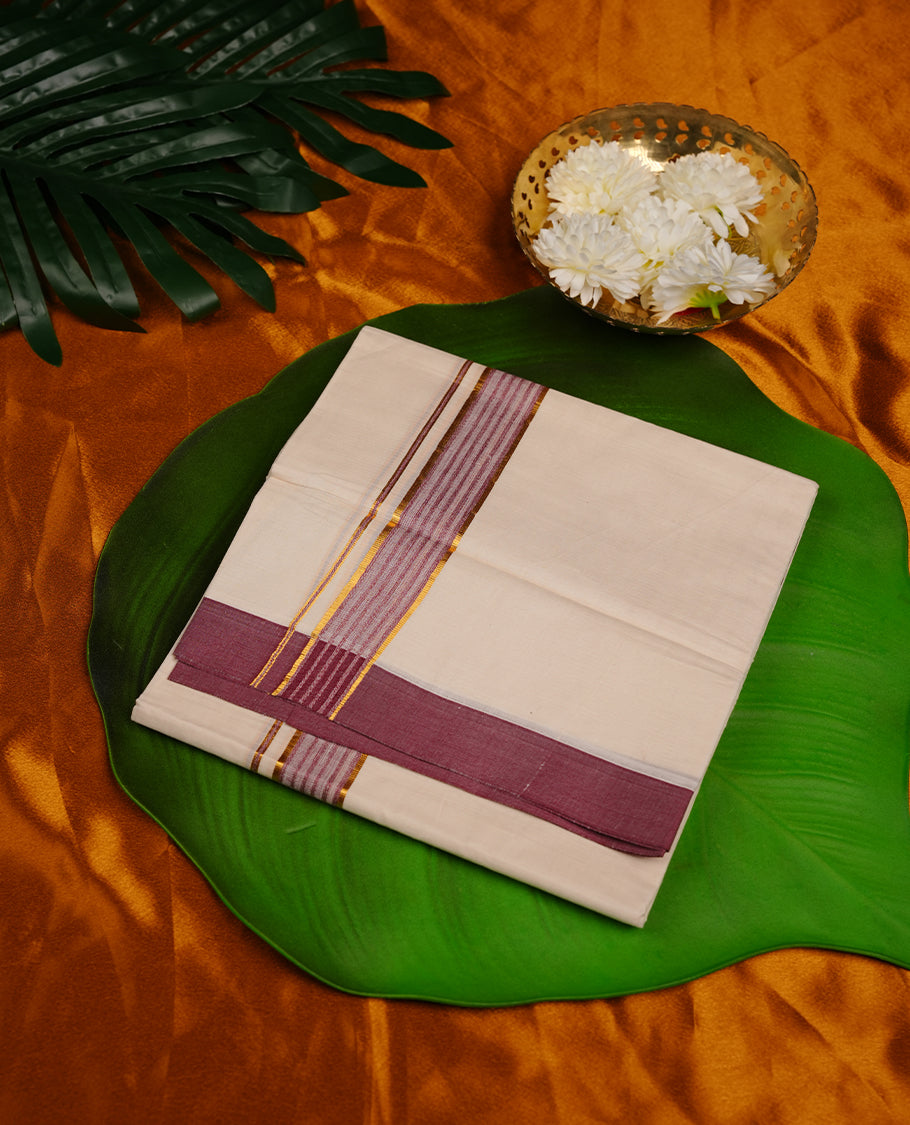 Cream colour cotton double dhoti featuring wine and gold zari border.