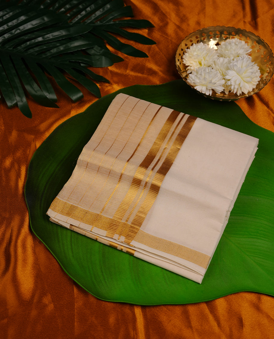 Cream colour cotton double dhoti featuring gold stripes kasavu zari border
