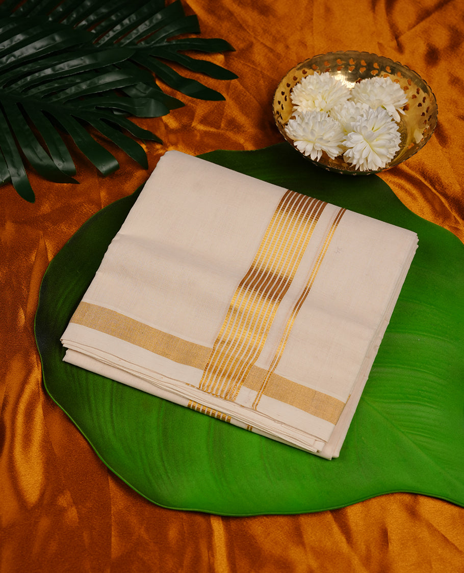 Cream colour cotton double dhoti featuring gold stripes kasavu zari border