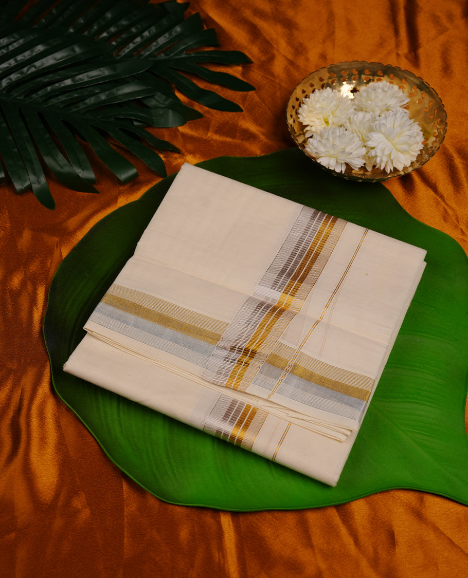 Cream colour cotton double dhoti featuring 3 inch gold and silver stripes kasavu zari border