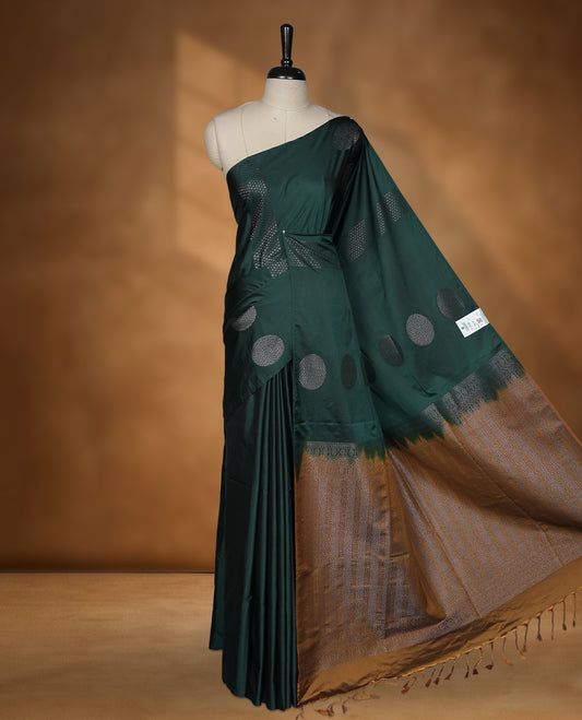 Green colour soft silk saree featuring Antique zari motifs on body with Highlighting contrast Mustard colour pallu and paired with matching blouse piece.