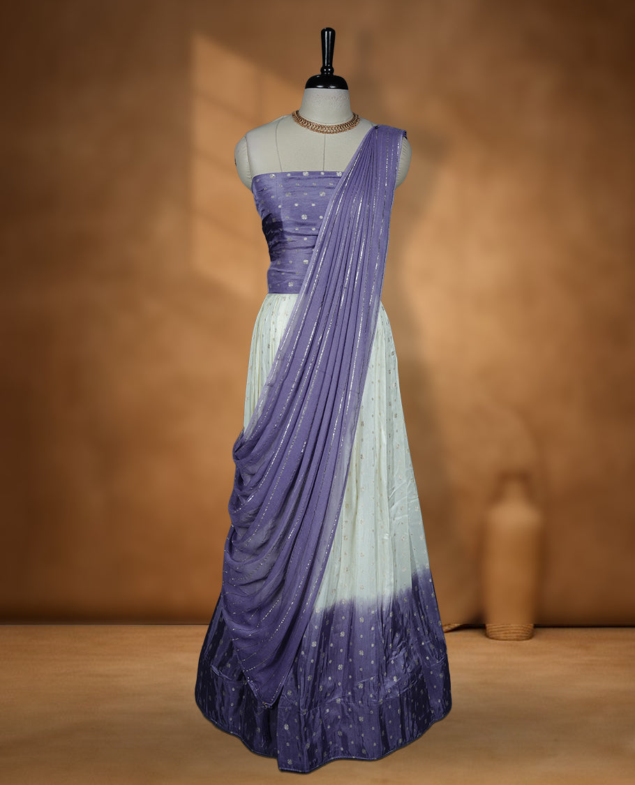 Off white semi banaras semi stitched dhavani set featuring gold zari motifs and contrast Lavender colour border, unstitched gold zari blouse piece and matching Duptta with gold zari stripes.