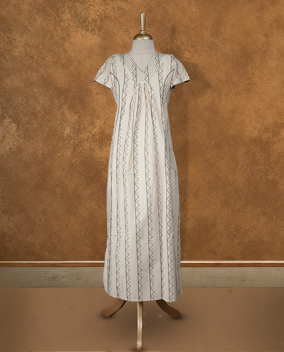 Cream colour NStyle nighty featuring dark green geometric patterns, a V-neckline with thread detailing, short sleeves, and a full ankle-length design.