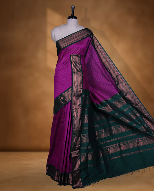 Magenta colour kalyani cotton saree featuring Antique zari check pattern on body, contrast Green colour border with antique zari pattern, paired with matching blouse piece.