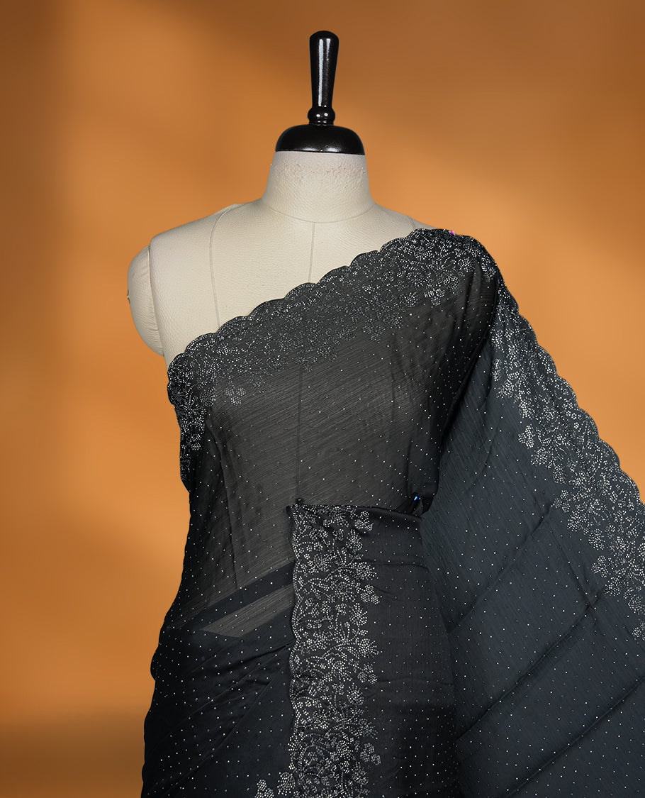 Black Colour Chiffon Designer Saree featuring Delicate White Stone Work All Over the Body, with Stone Detailing on the Border and Pallu, paired with a Matching Blouse.