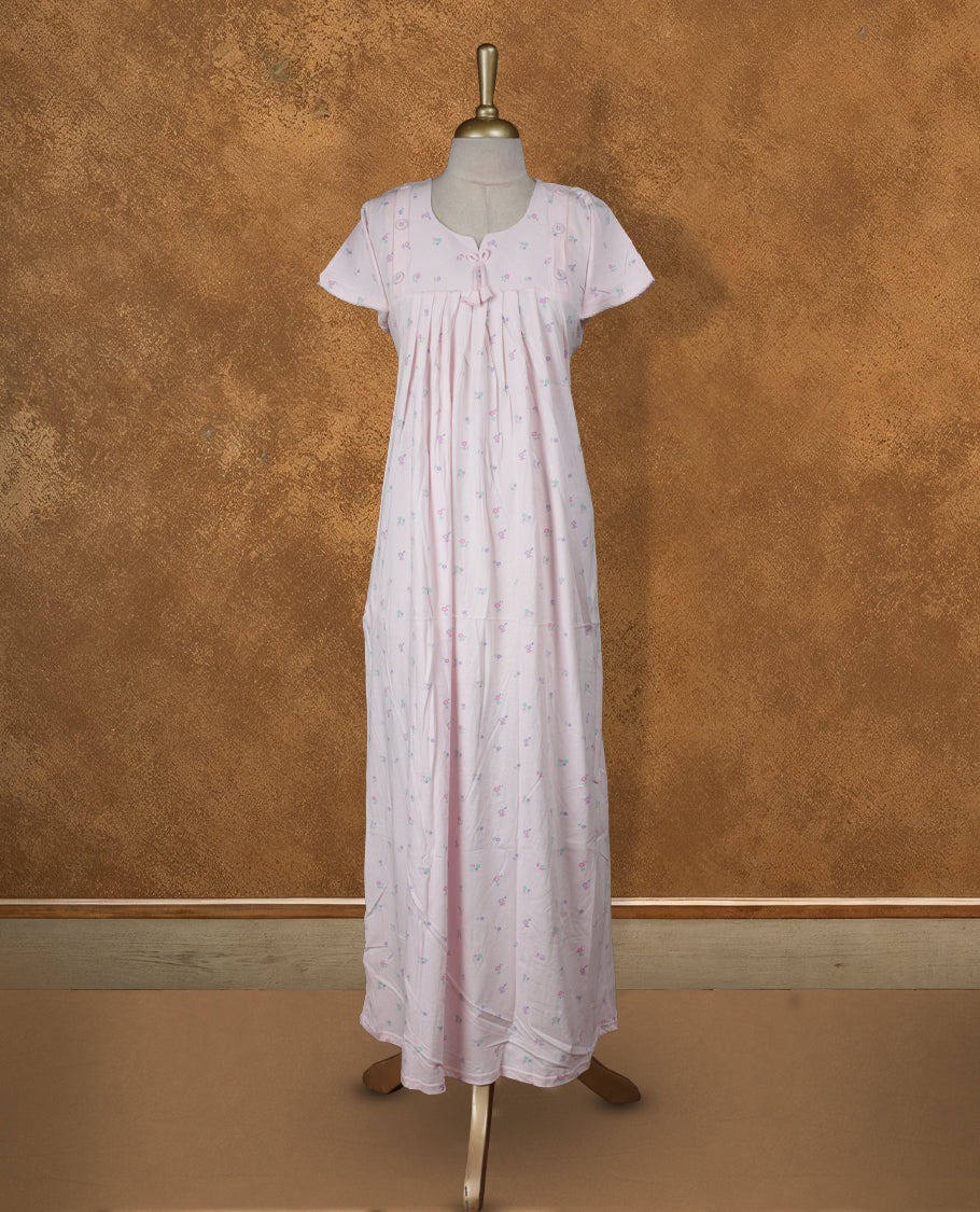 Baby pink colour Nstyle nighty with featuring a floral pattern, a Round neckline with slit cut, Short sleeve, and a full-length