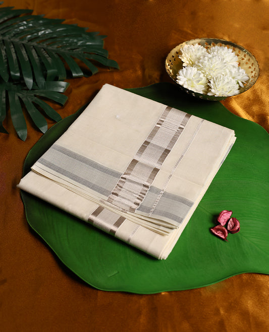 Traditional off white colour pure cotton dhoti featuring a subtle silver tissue border, exuding refined elegance and comfort, perfect for festive rituals, temple visits, and cultural celebrations.