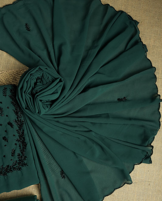 Elegant teal colour suit material adorned with intricate black cut beads work, exuding sophisticated charm & paired with a soft dupatta and a matching plain bottom.