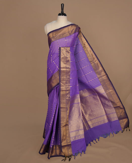 Medium Purple colour chettinad cotton saree featuring gold zari stripes on body, complemented by gold zari border, paired with matching blouse piece.