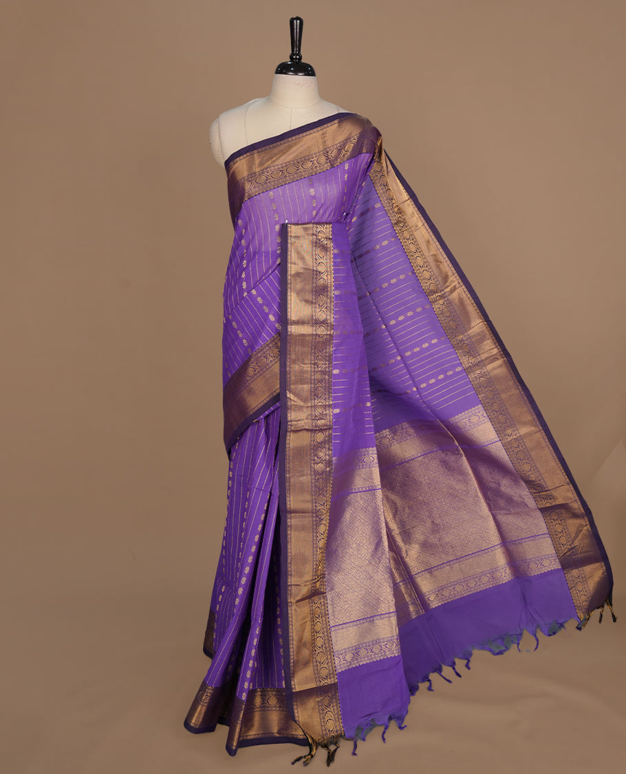 Medium Purple colour chettinad cotton saree featuring gold zari stripes on body, complemented by gold zari border, paired with matching blouse piece.