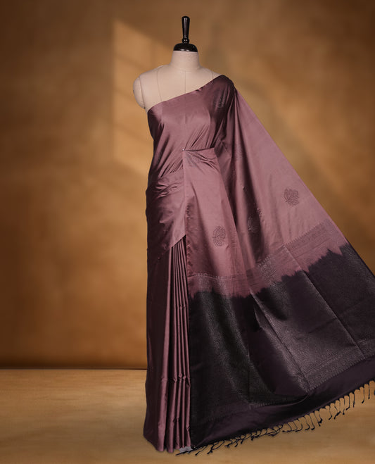 Mauve colour soft silk saree featuring Antique zari motifs on body with Highlighting contrast Plum purple colour pallu and paired with matching blouse piece.