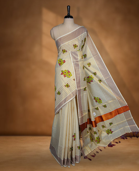 Light gold colour Tissue Kerala saree featuring a Plain body, an intricately woven gold and brown traditional border with floral and stripes on pallu, print paired with a matching blouse.