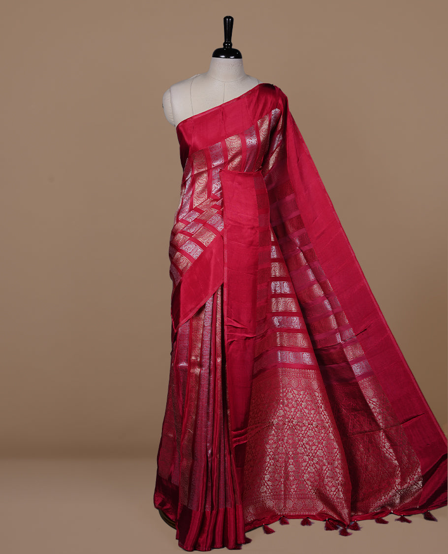 Rani pink colour banaras crepe saree featuring gold & silver zari design stripes on body, complemented by self colour border, paired with matching blouse piece.