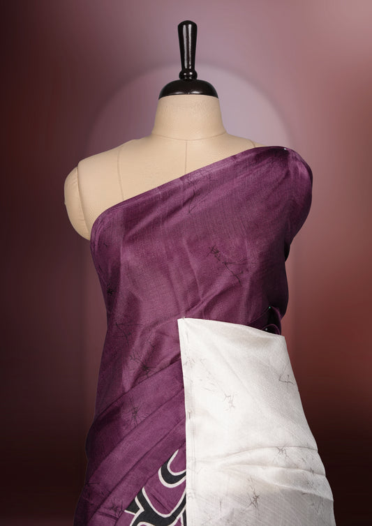 Dark onion pink colour saree adorned with bold off white floral prints, blending tradition with a modern twist & paired with a matching blouse.