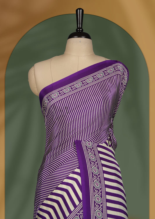 Purple and cream colour striped saree with intricate embroidered borders and bold round pallu motifs & Includes matching blouse piece.