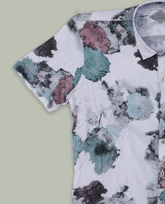 White colour short sleeve shirt features a rounded spread collar and a watercolor style floral print in teal, maroon, and black & its ideal for both casual days and laid back evenings.