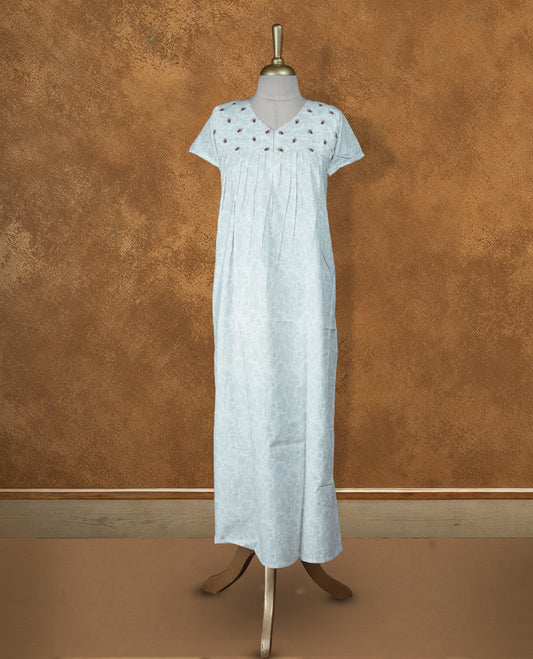 Off White colour NStyle nighty featuring  greenish white floral patterns, a V-neckline, short sleeves, and a full ankle-length design.