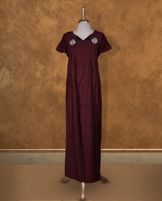Dark red colour NStyle nighty featuring white floral thread on front & black patterns, a V-neckline, short sleeves, and a full ankle-length design.