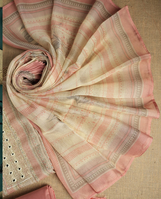 Pastel peach and beige colour suit material with delicate woven mirror work patterns and subtle zari detailing & Includes a soft dupatta with a floral touch and plain matching bottom.