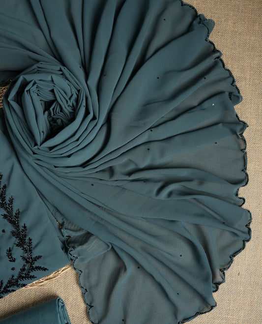 Elegant grey colour suit material adorned with intricate black cut beads work, exuding sophisticated charm & paired with a soft dupatta and a matching plain bottom.