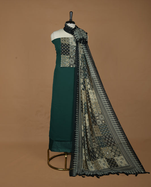 Green colour georgette salwar suit collection featuring plain body enhanced with elegant black bunch kalamkari print on neck yoke, detailed with subtle mirror work , paired with kalamkari printed dupatta with mirror work with santon material bottom.