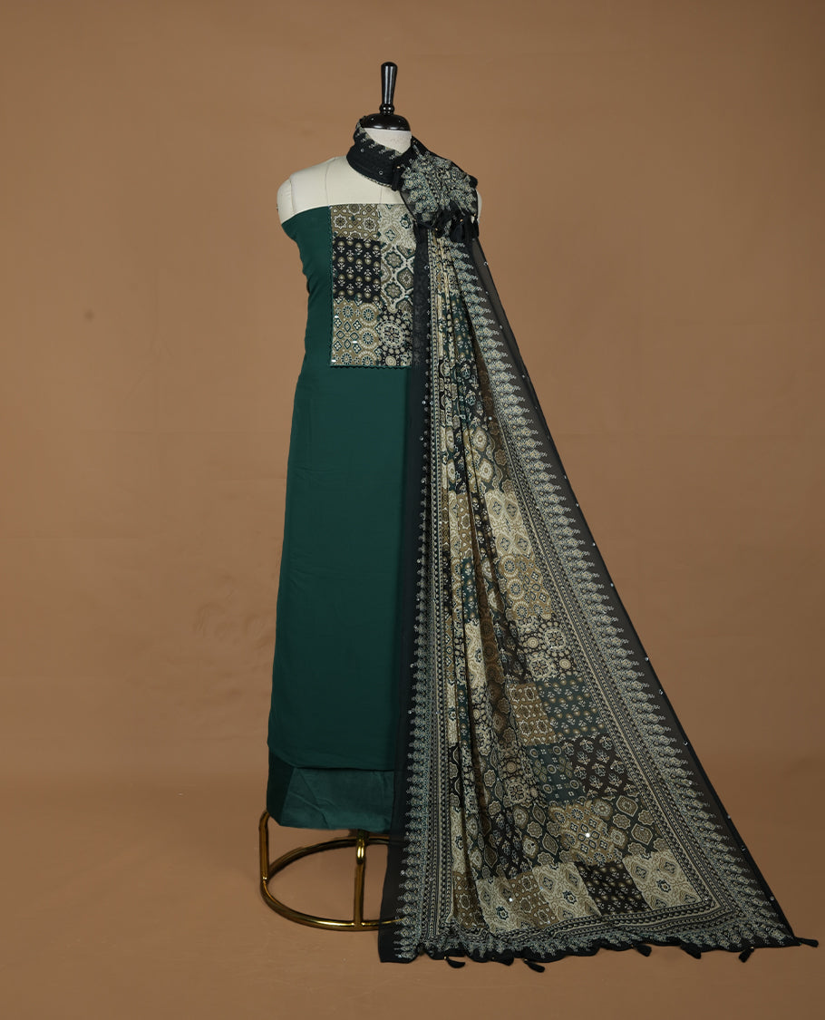 Green colour georgette salwar suit collection featuring plain body enhanced with elegant black bunch kalamkari print on neck yoke, detailed with subtle mirror work , paired with kalamkari printed dupatta with mirror work with santon material bottom.