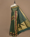 Green colour chettinad cotton saree featuring gold zari stripes on body, complemented by gold zari with maroon border, paired with matching blouse piece.