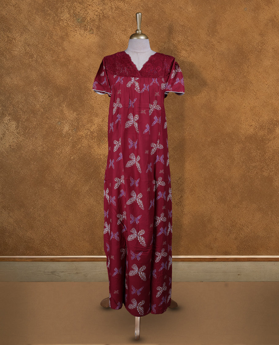 Dark red colour NStyle nighty featuring butterfly patterns, a V neckline with design lace, short sleeves, and a full ankle-length design.