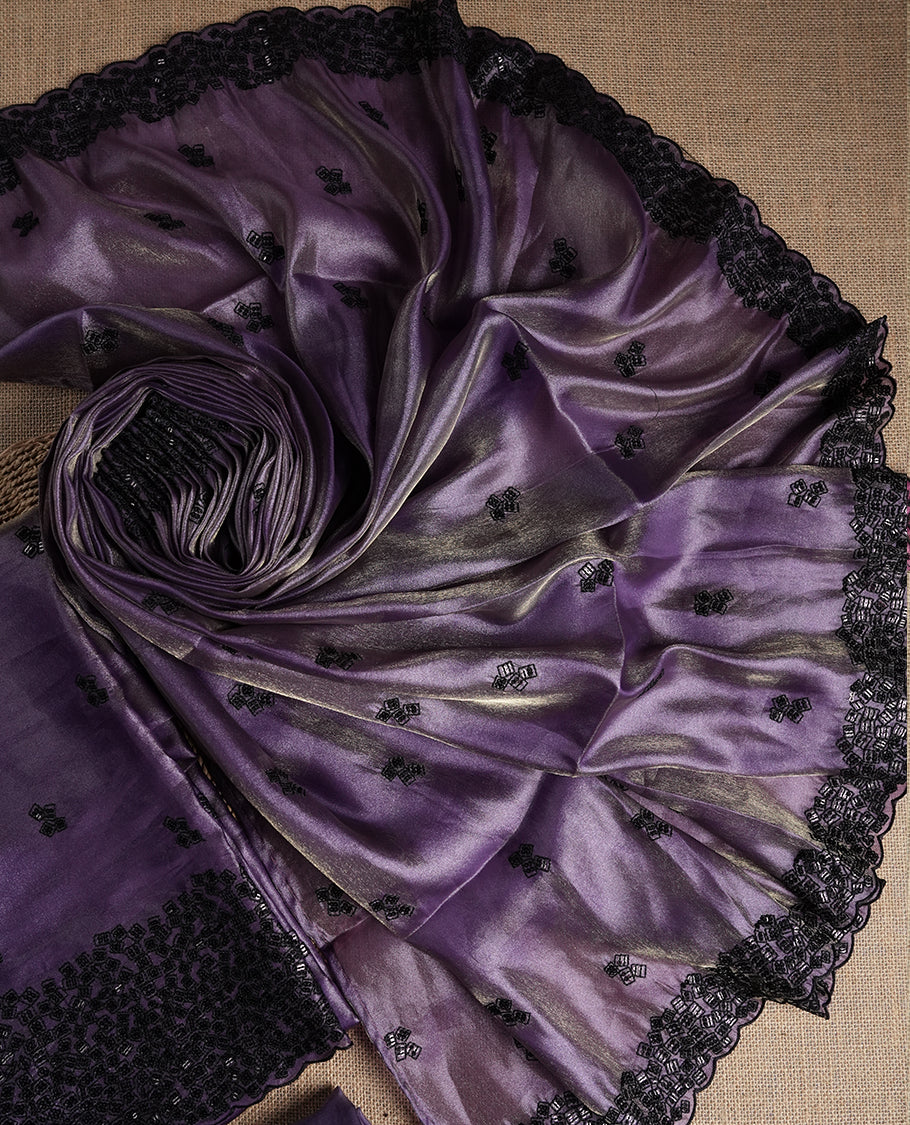 Soft purple colour dual shaded suit material featuring intricate black thread and sequin embroidery with a delicate lace border, Paired with a matching embroidered dupatta and plain bottom.