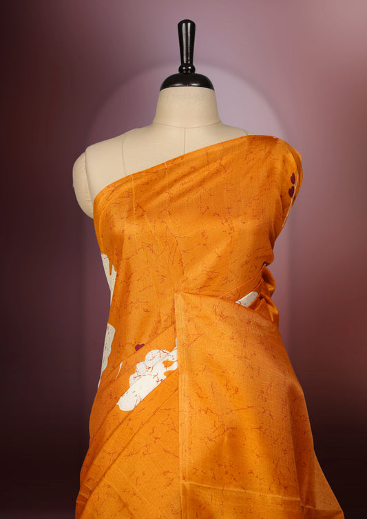 Rust orange colour saree adorned with bold off white floral prints, blending tradition with a modern twist & paired with a matching blouse.