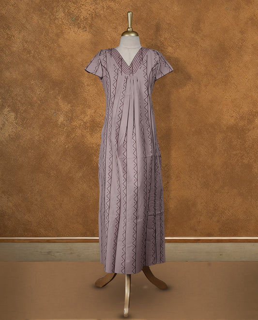 Pastel purple colour NStyle nighty featuring Dark red geometric patterns, a V neckline with dark red theard border, short sleeves, and a full ankle-length design.