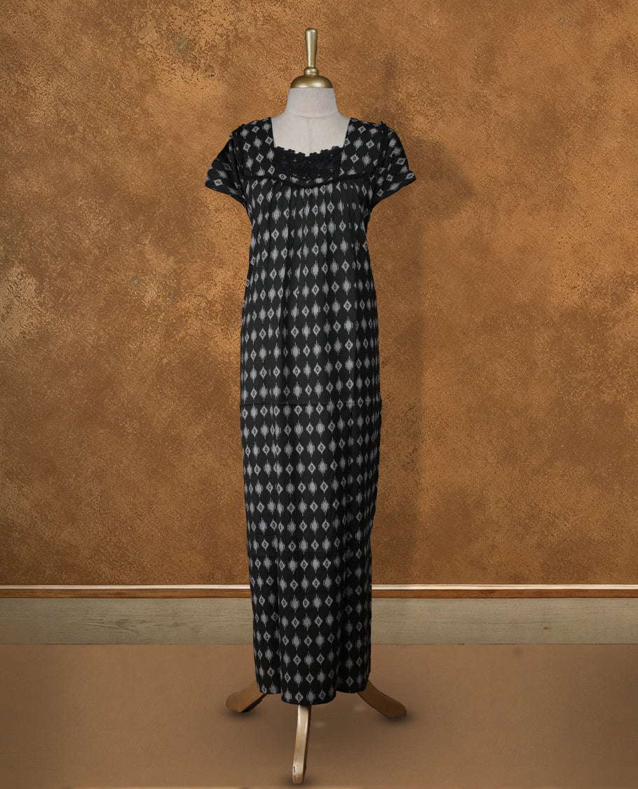 Black colour NStyle nighty featuring white diamond patterns, a Diamond neckline and lace border, short sleeves, and a full ankle-length design.